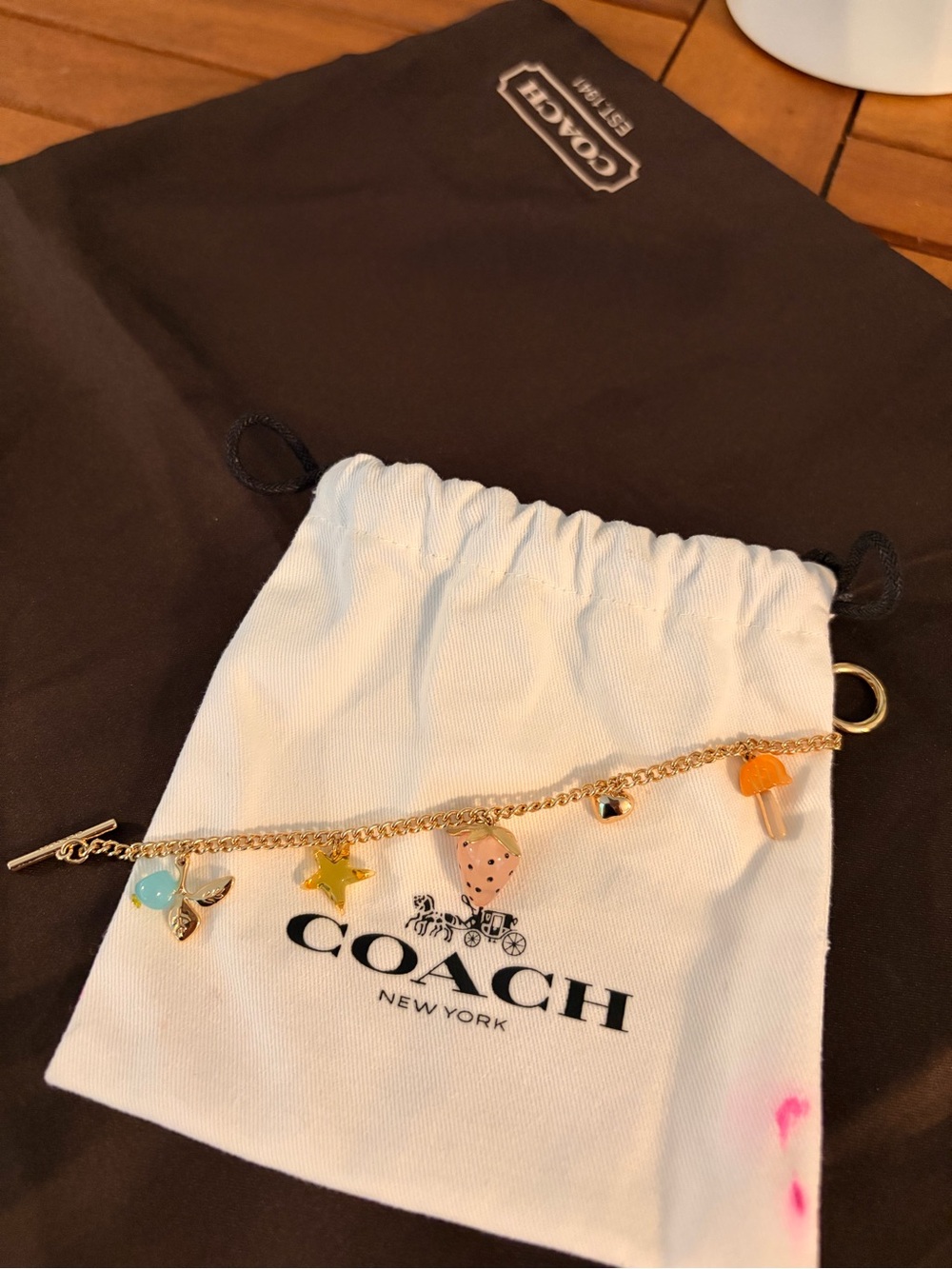 Coach Gold-Tone Charm Bracelet with Pink, Yellow, Blue & Orange Accents